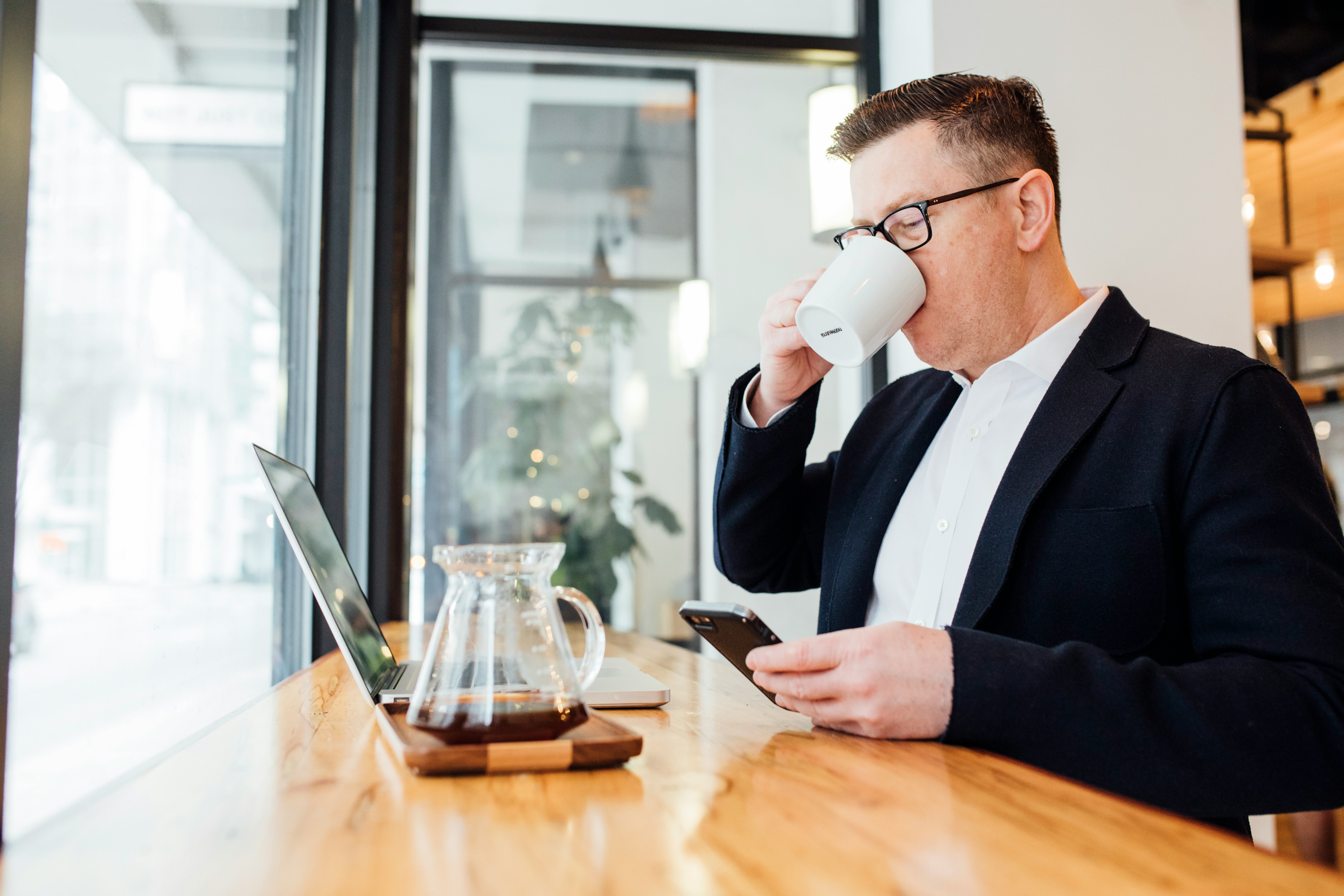 Business success - relaxed professional at desk